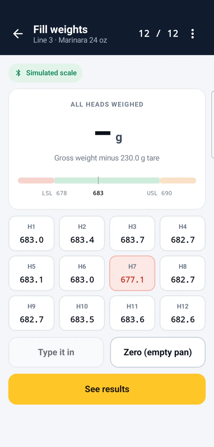 FloorCheck on a phone: fill weights for 12 filler heads, head 7 in red below the lower limit